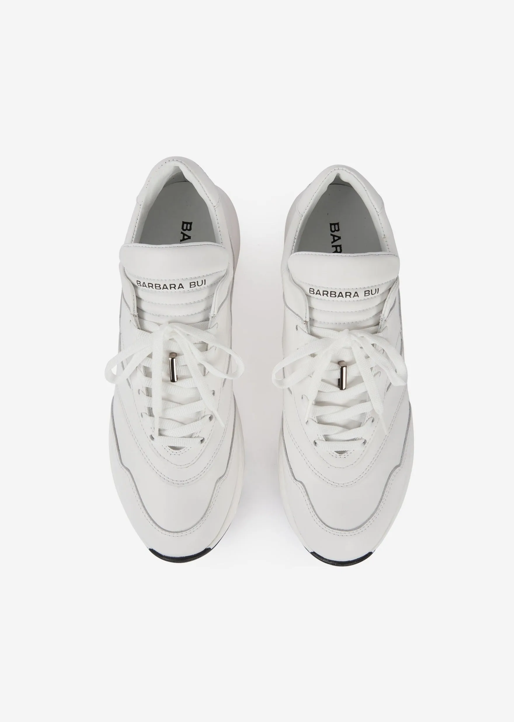 White leather running shoes
