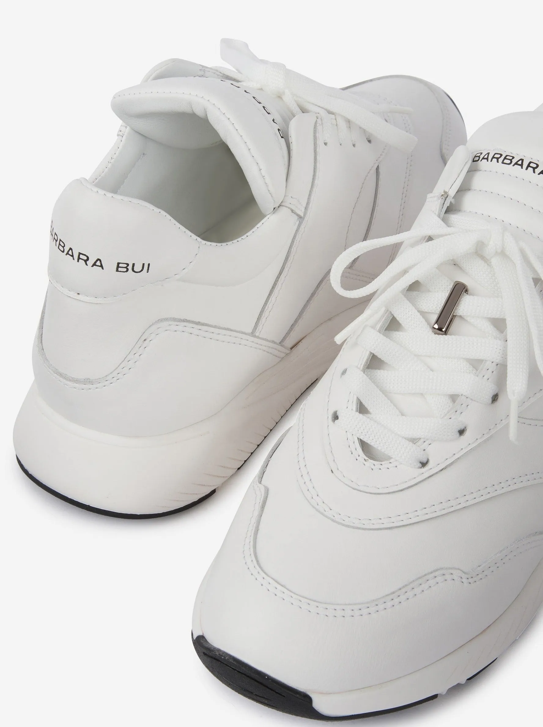 White leather running shoes