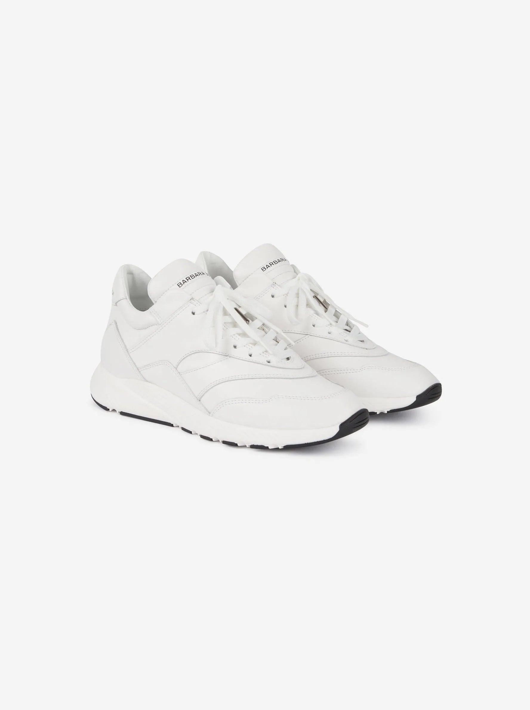 White leather running shoes